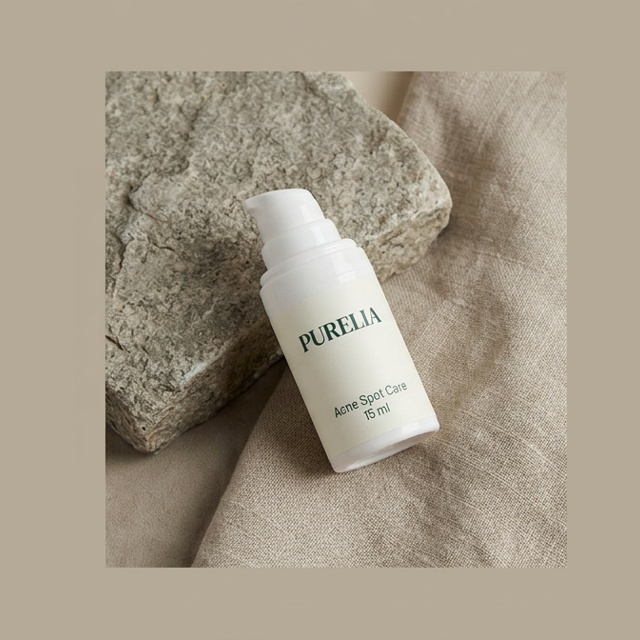 Purelia Acne Spot Care — Purelia-labelled product arranged on stone and linen